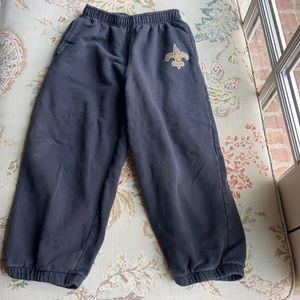 Kids sweatpants with New Orleans Saints logo.
